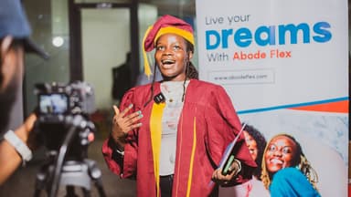Associate in graduation gown